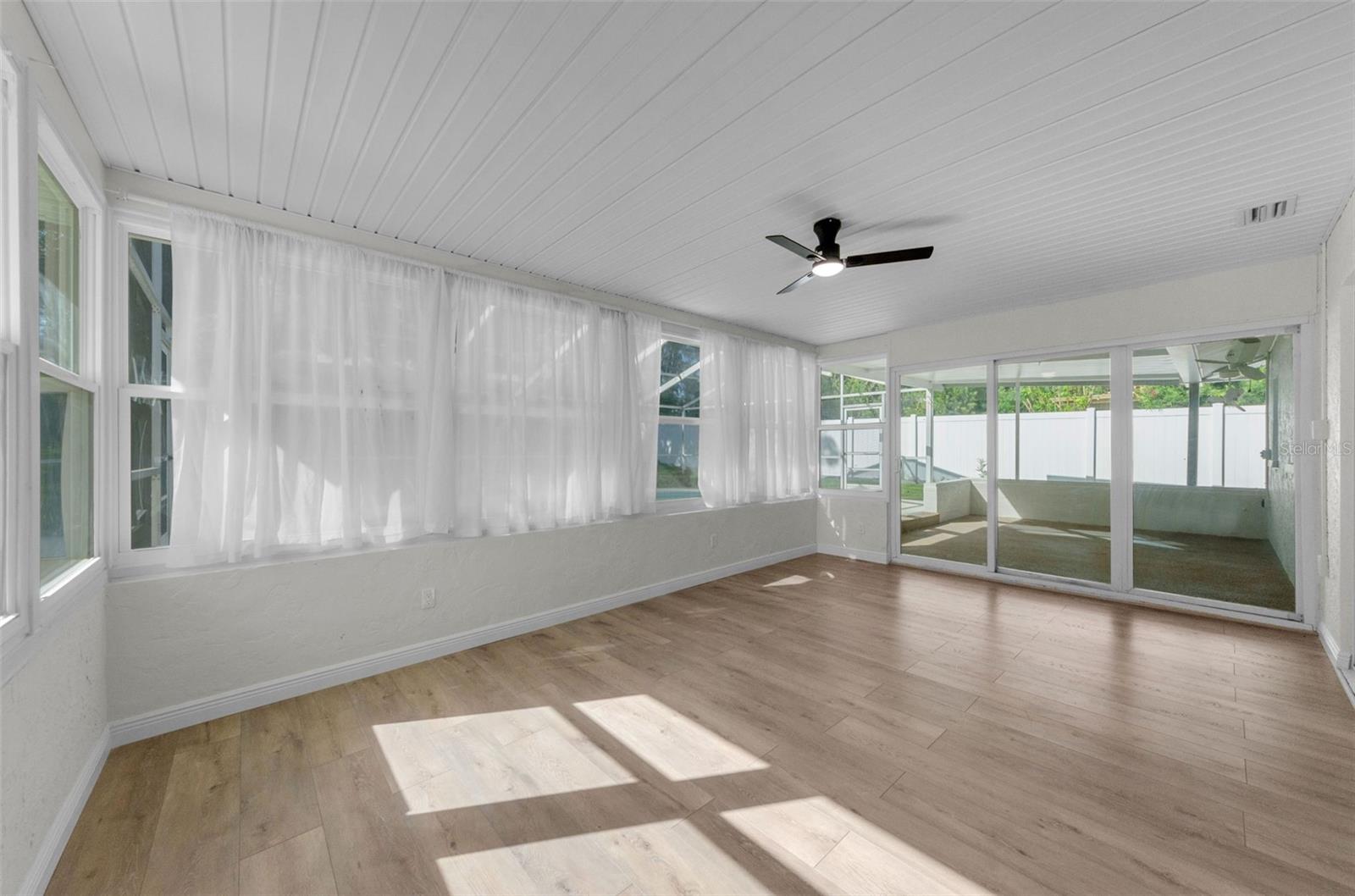 HOW ABOUT ADDING ALL THIS EXTRA SQ FOOTAGE IN YOUR BEAUTIFUL SUNROOM