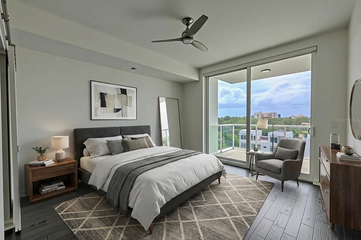 Bedroom 3 is an open and uplifting space,  with rich hardwood flooring, crisp white walls, and floor-to-ceiling sliding glass doors that open to a private balcony with lush city and water views. The room is light-filled and airy, complemented by a sleek ceiling fan and modern architectural lines. The en-suite bath and walk-in closet create a comfortable, private suite perfect for guests or extended family. Its direct access to the balcony makes it an inviting space to start or end the day with a view.