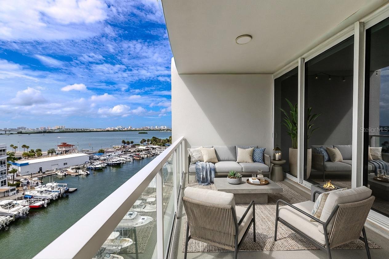 From your private balcony, take in the sights of passing boats, lush waterfront residences, and the stunning skyline beyond—all while basking in the warm Gulf breeze.