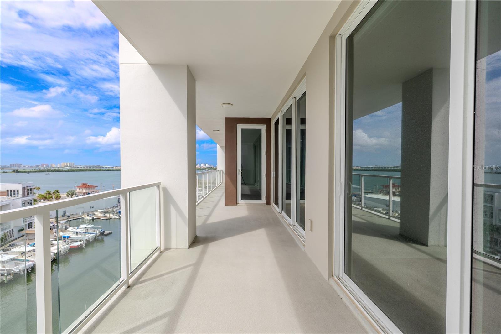 Enjoy stunning views from nearly every room, with floor-to-ceiling glass doors leading to an expansive balcony that invites you to relax and take in the breathtaking scenery.