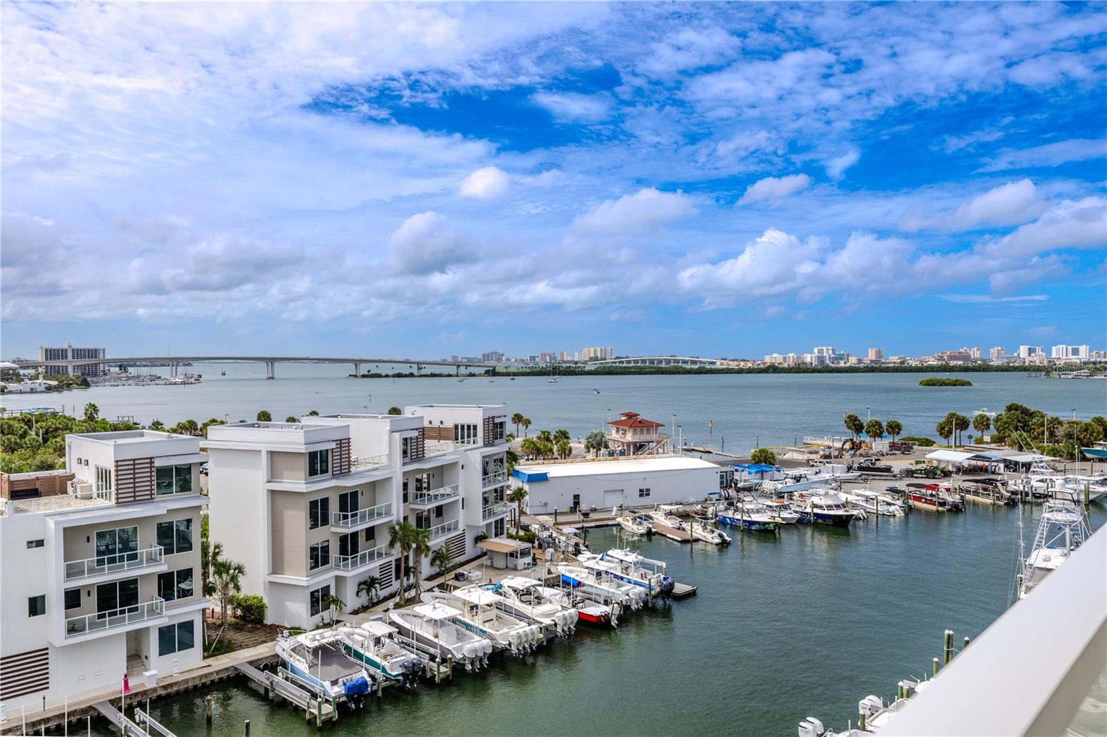 Overlooking the Intracoastal Waterway and marina, this outdoor retreat captures both the Memorial Causeway and Sand Key Bridge—each glowing beautifully at night.