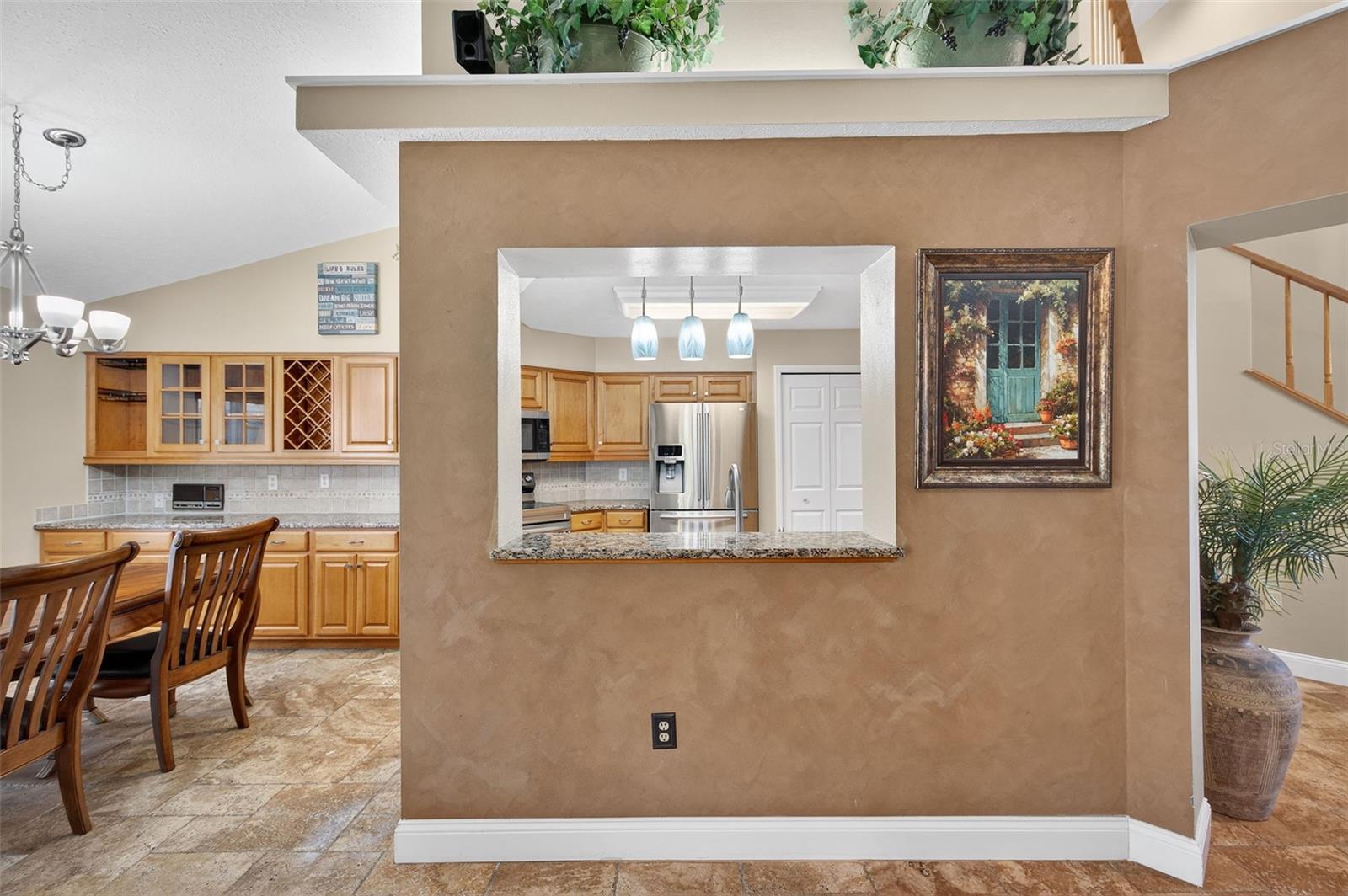 view of kitchen and eat in area from family room