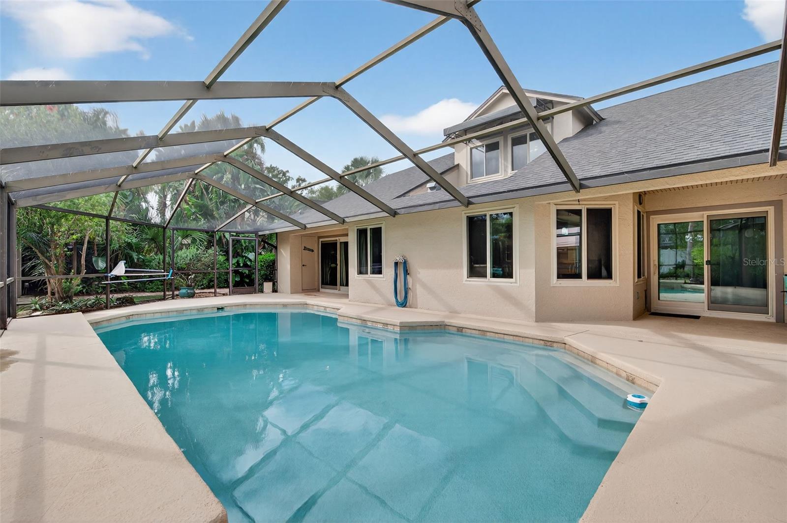 pool and deck with half bath
