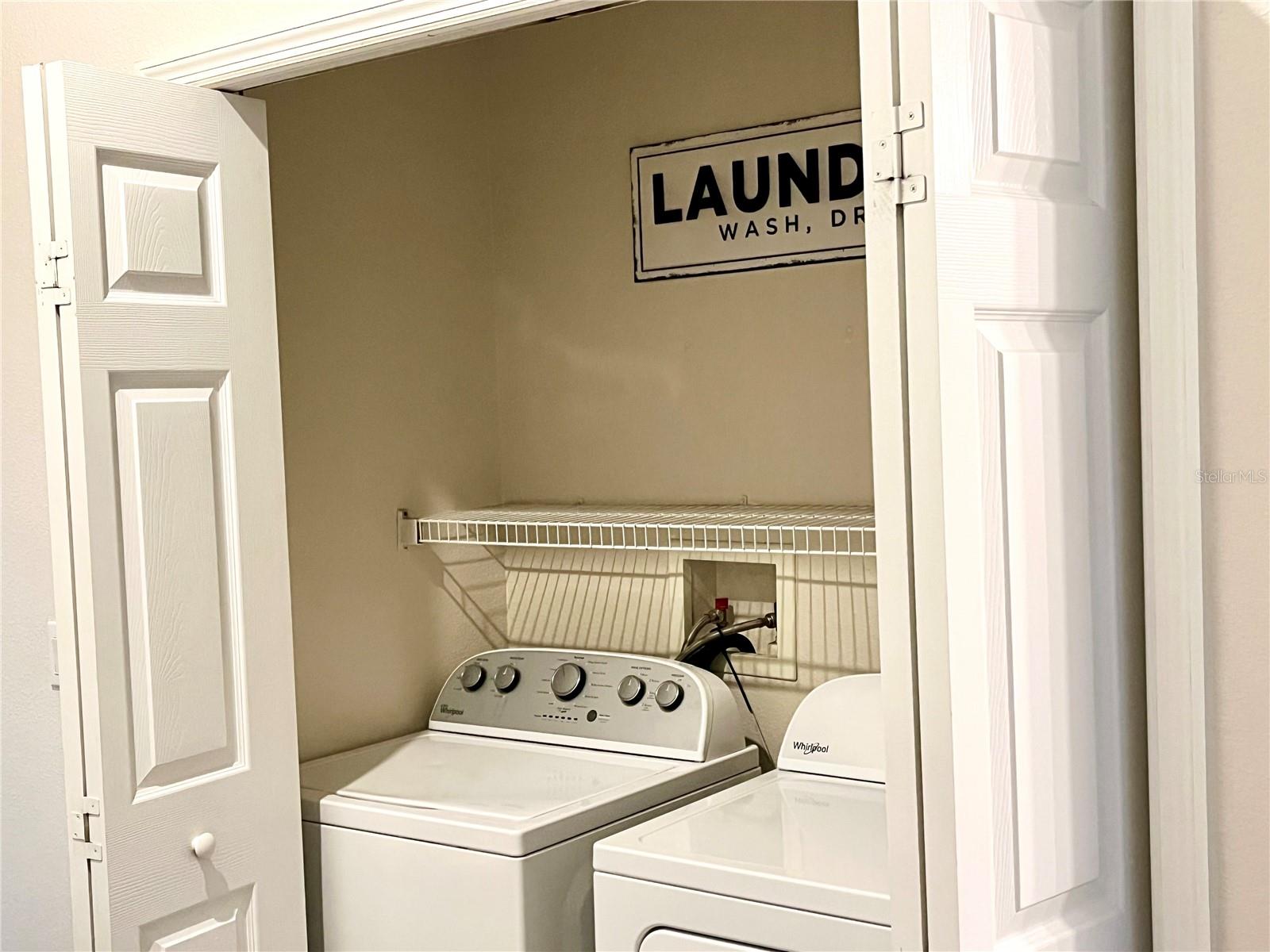 Laundry Between Rooms in Hall.