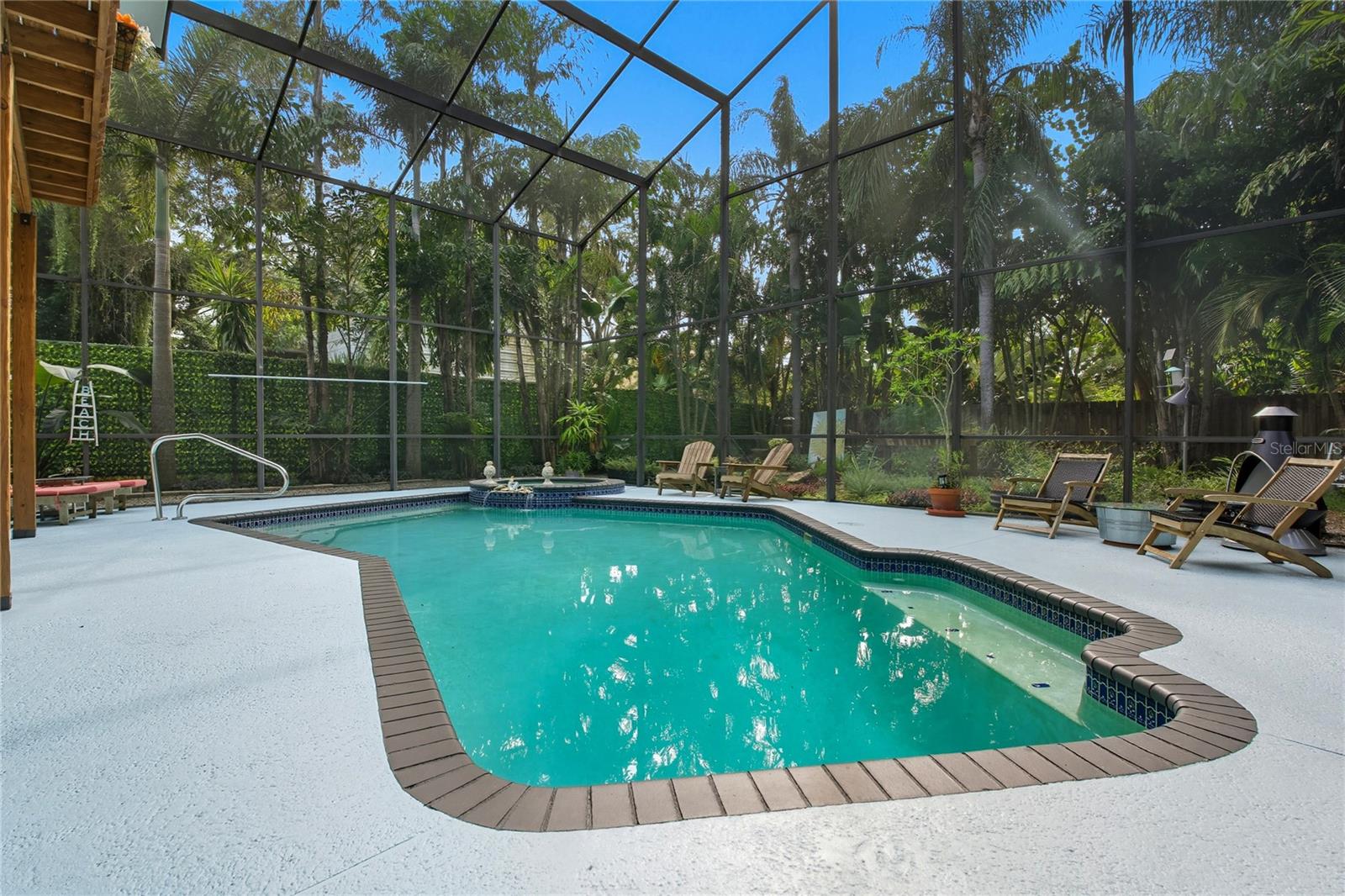 MATURE LANDSCAPING SURROUNDING THE POOL ~ YOU ARE RIGHT DOWNTOWN OZONA, BUT CAN ESCAPE IN YOUR BACKYARD TROPICAL OASIS ~ THE BEST OF BOTH WORLDS!