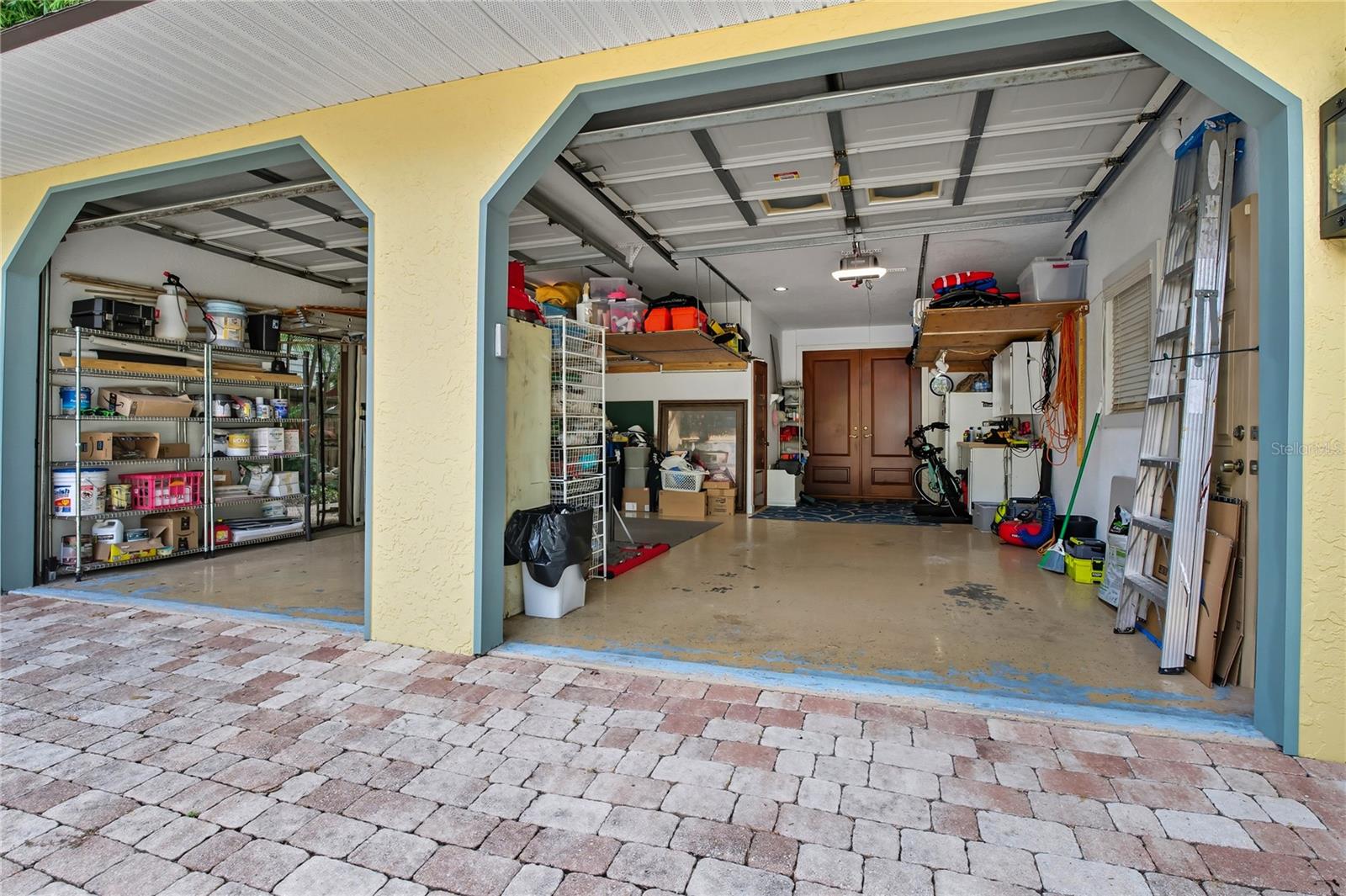 OVER-SIZED, TWO CAR GARAGE, WITH PLENTY OF SIDE AND OVERHEAD STORAGE