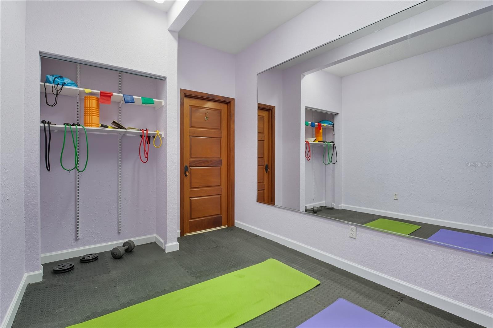AIR CONDITIONED ROOM THAT IS PERFECT AS A WORKOUT ROOM OR ARTS AND CRAFTS ROOM!