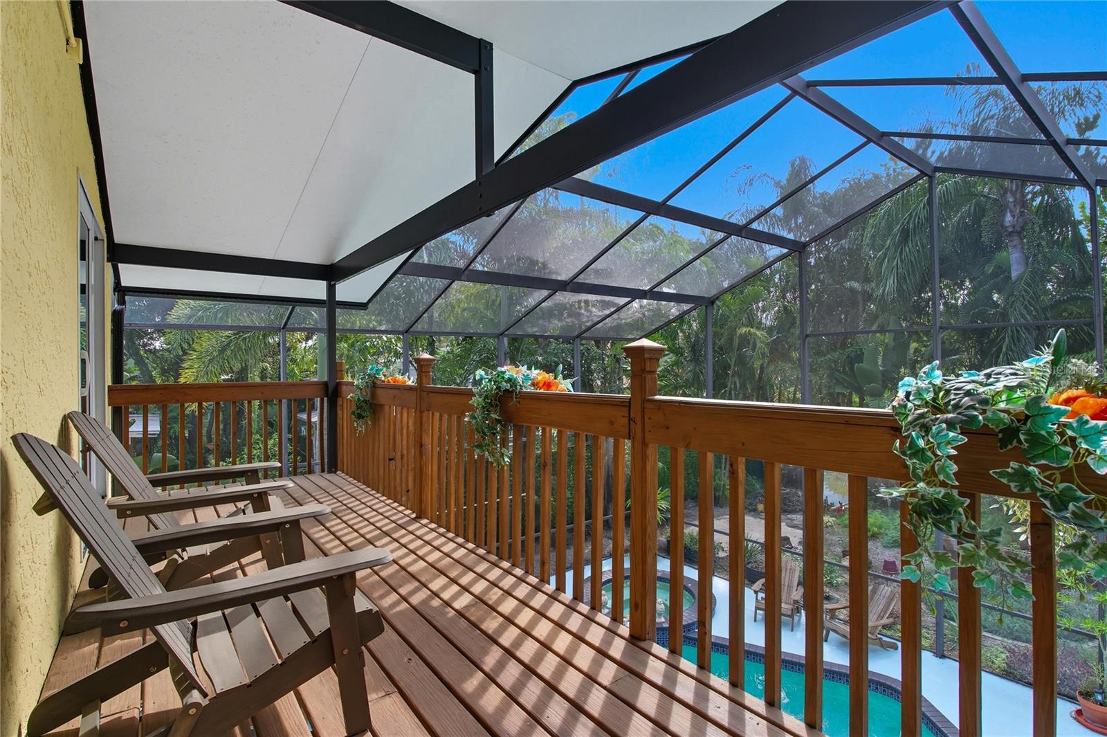 COVERED, PRIVATE BALCONY OFF OF THE PRIMARY SUITE