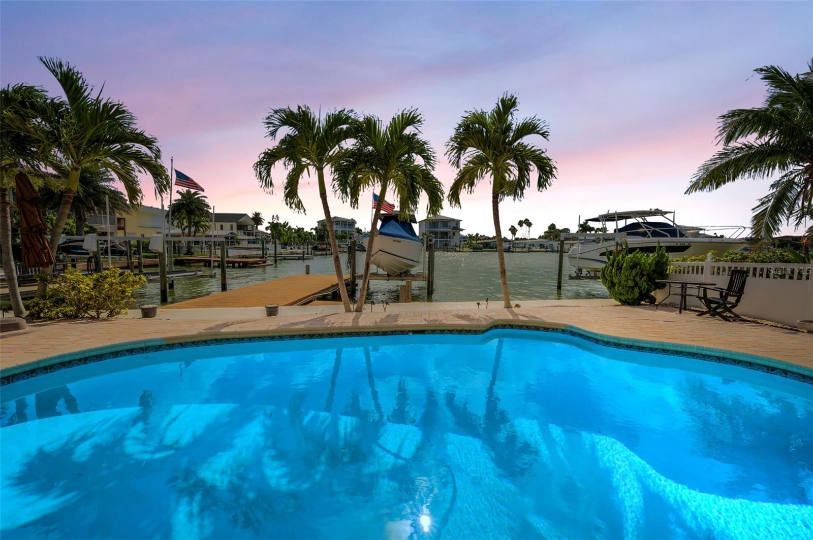 Sparkling pool overlooking sparkling waters.
