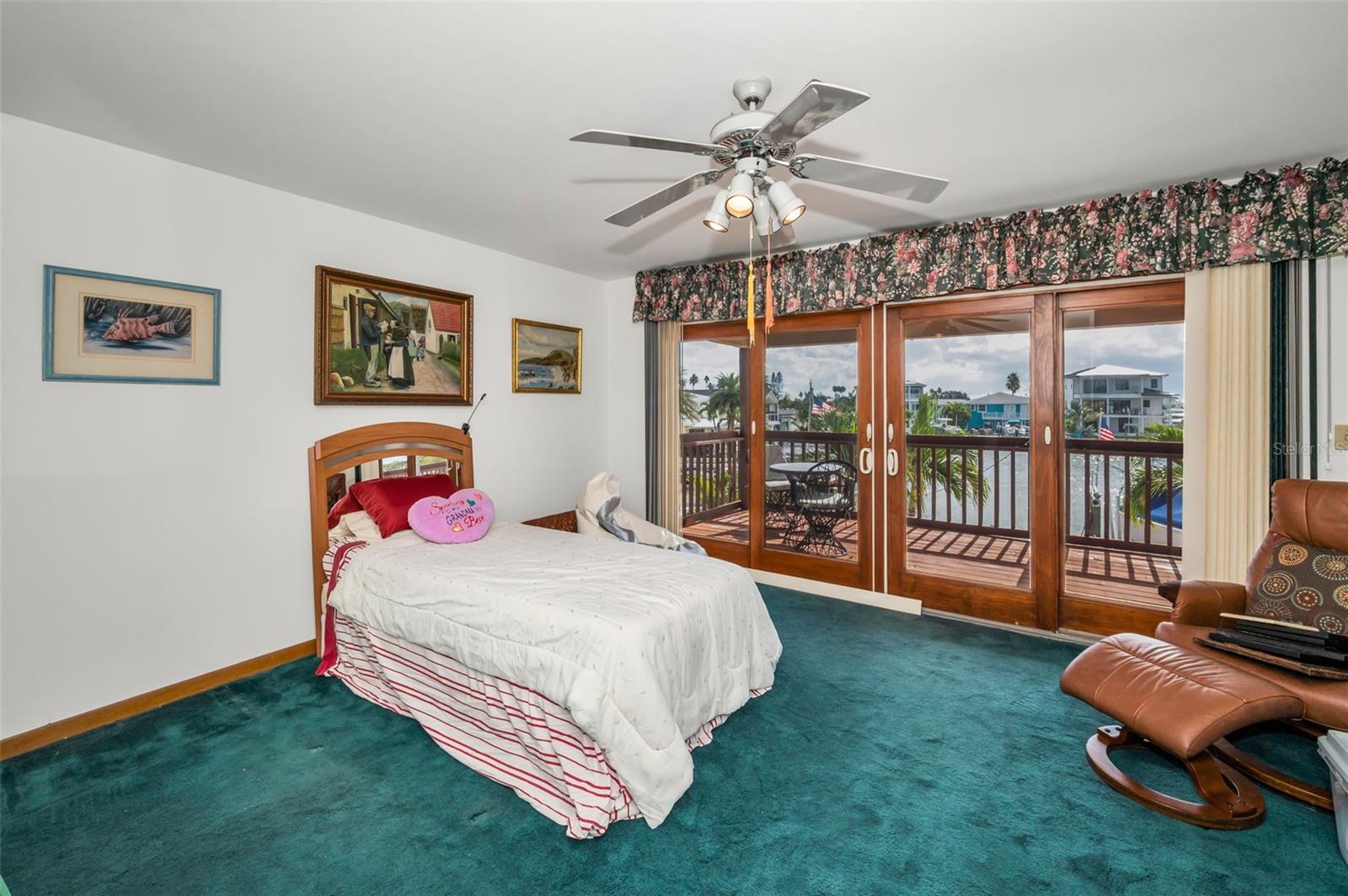 Guest bedroom on second floor with water views.