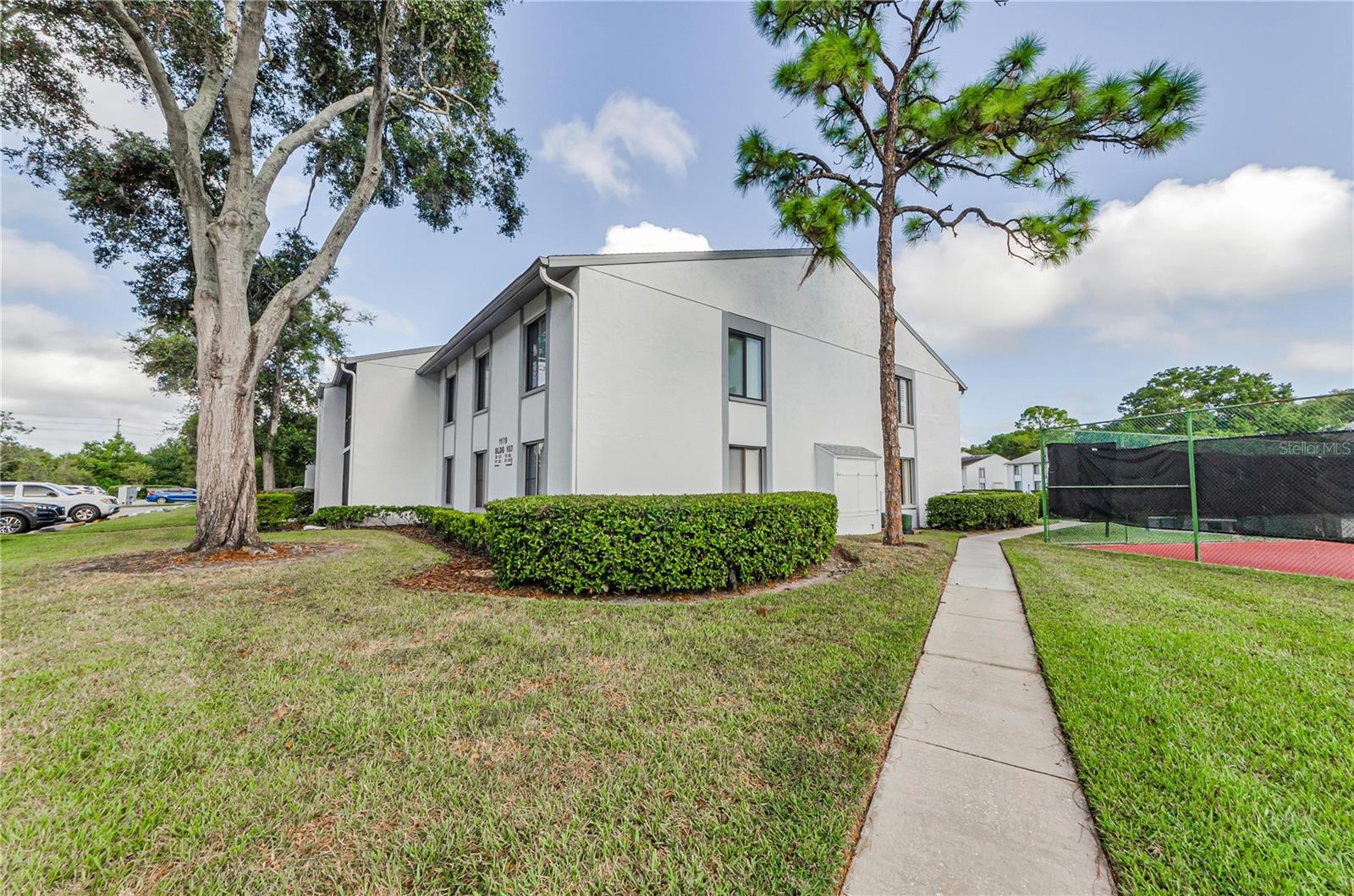 Sidewalk leading to back of bldg to unit
