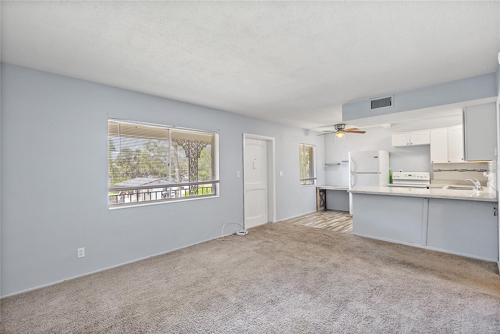 Living Room OPENS to Kitchen
