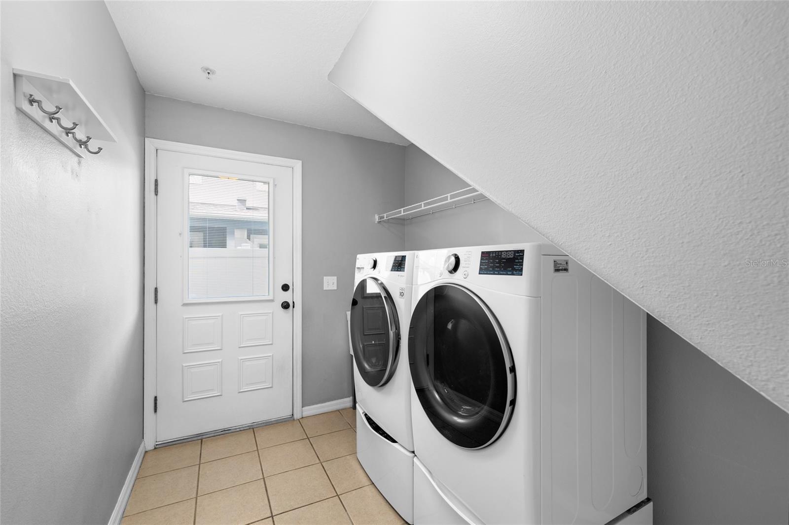 Floor 1: Laundry room, door to backyard