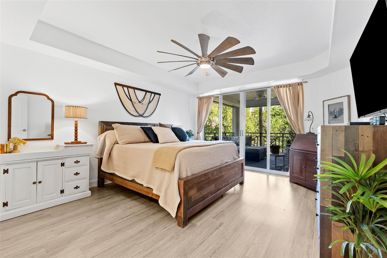 Primary Bedroom with ensuite bathroom and access to lanai.