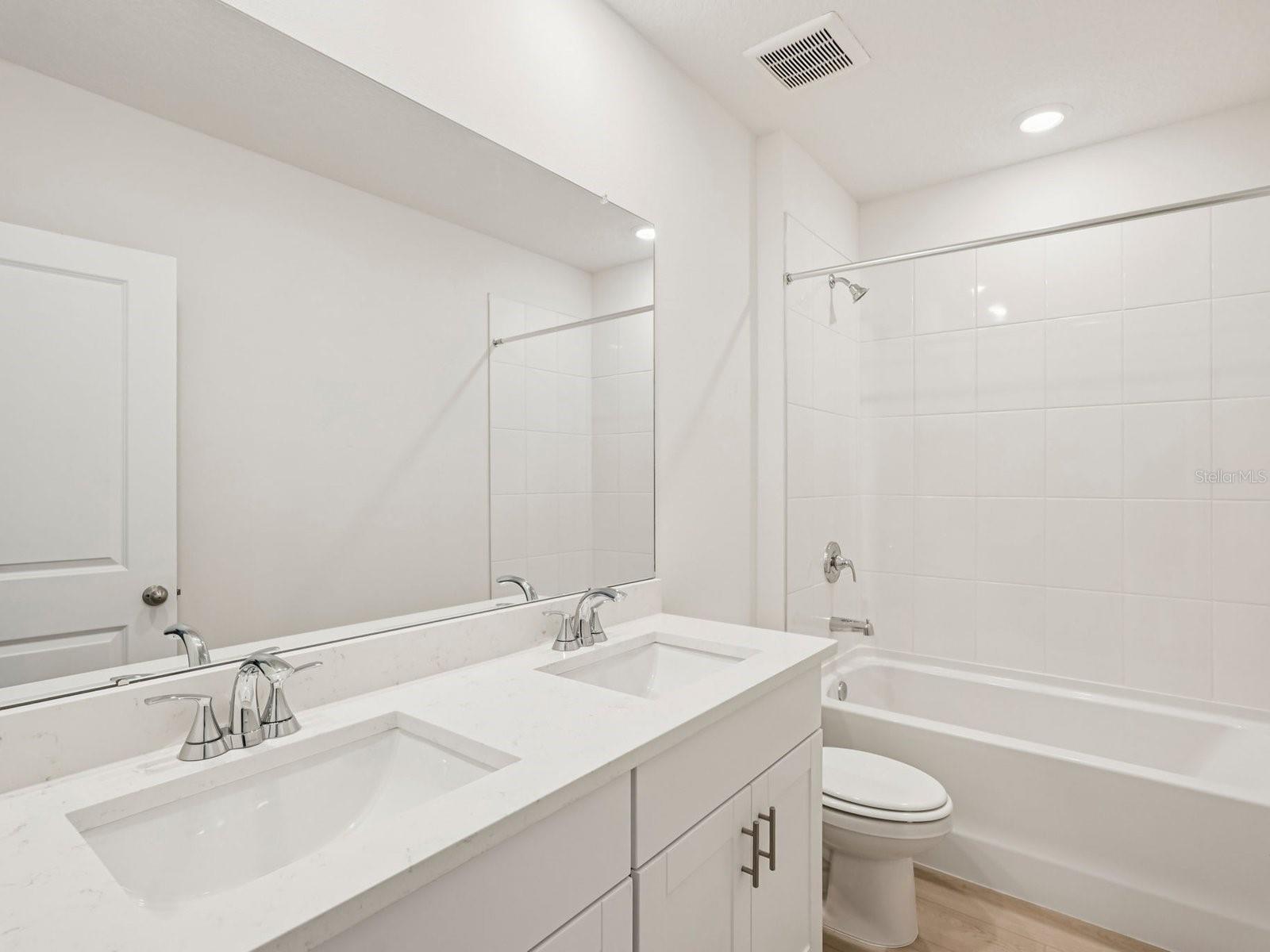 Interior photos are not of the actual home but are photos of the builder home with same floorplan with similar interior finishes and features.