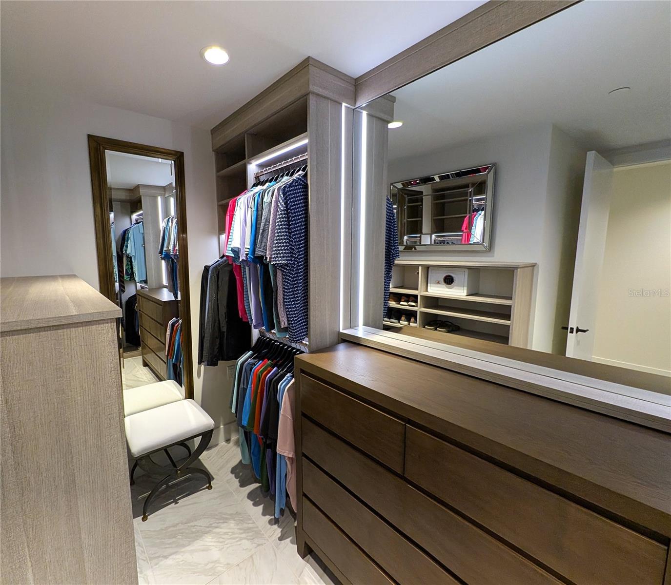 Primary Closet with California Closets Pietra Finish and Integrated Lighting