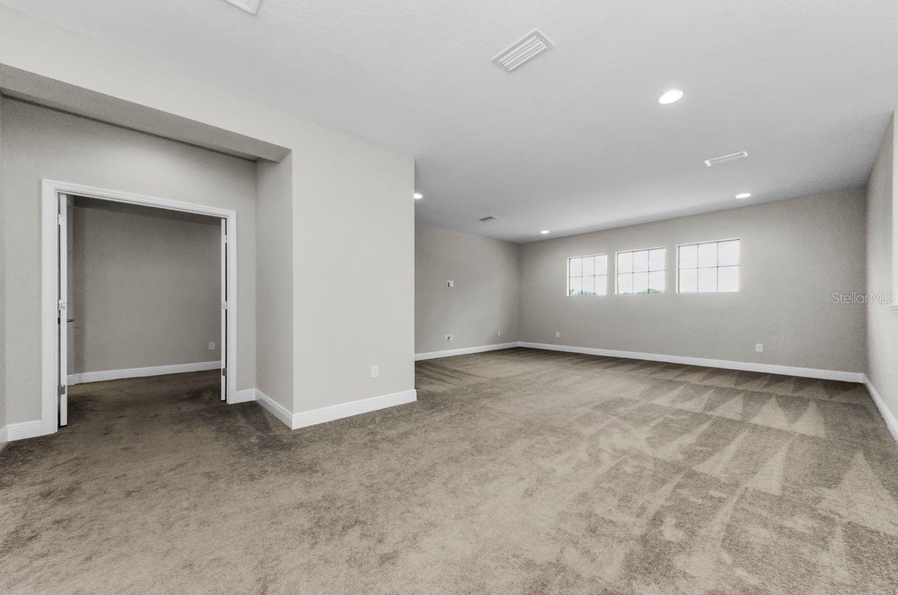 Large loft,  double doors lead to primary bedroom