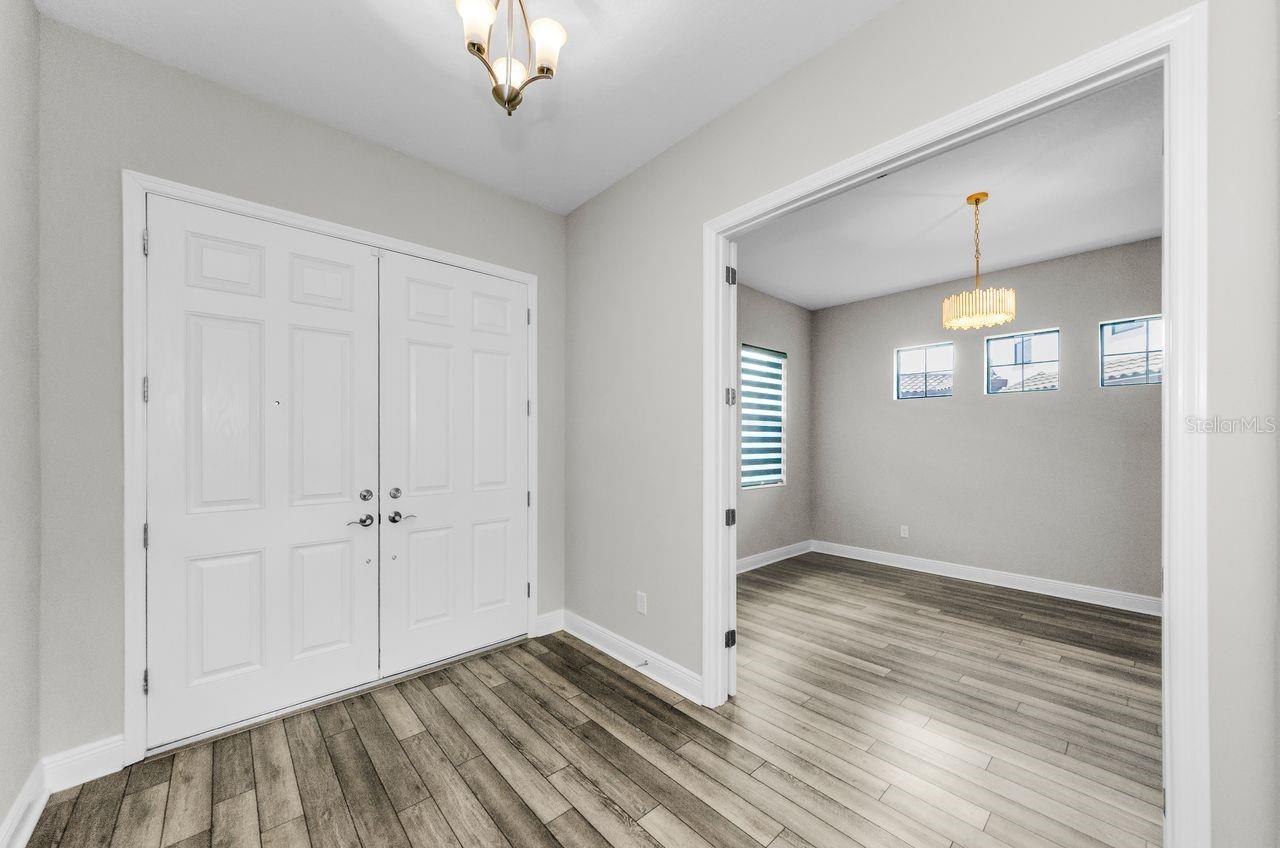 Front double door shown on left and flex room with double door open