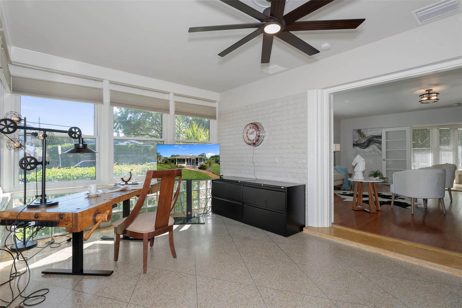 The den is an ideal home office where you can birdwatch or simply enjoy the neighborhood views.