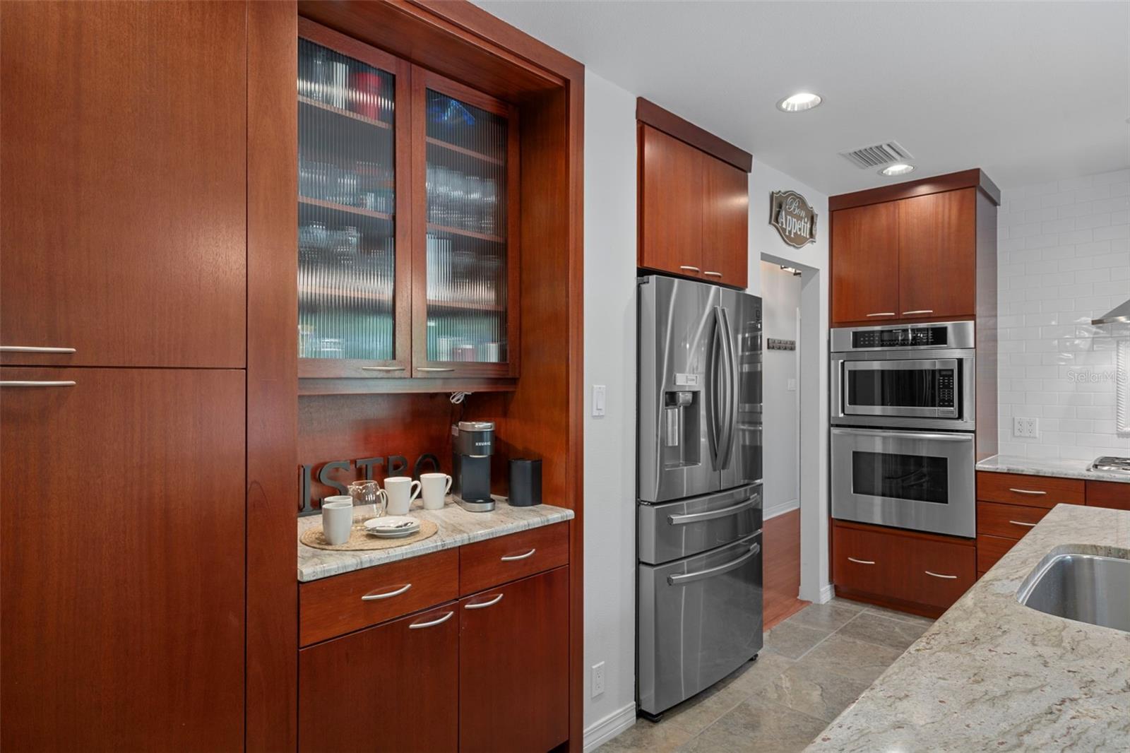 Built-in coffee nook and abundant cabinet storage.