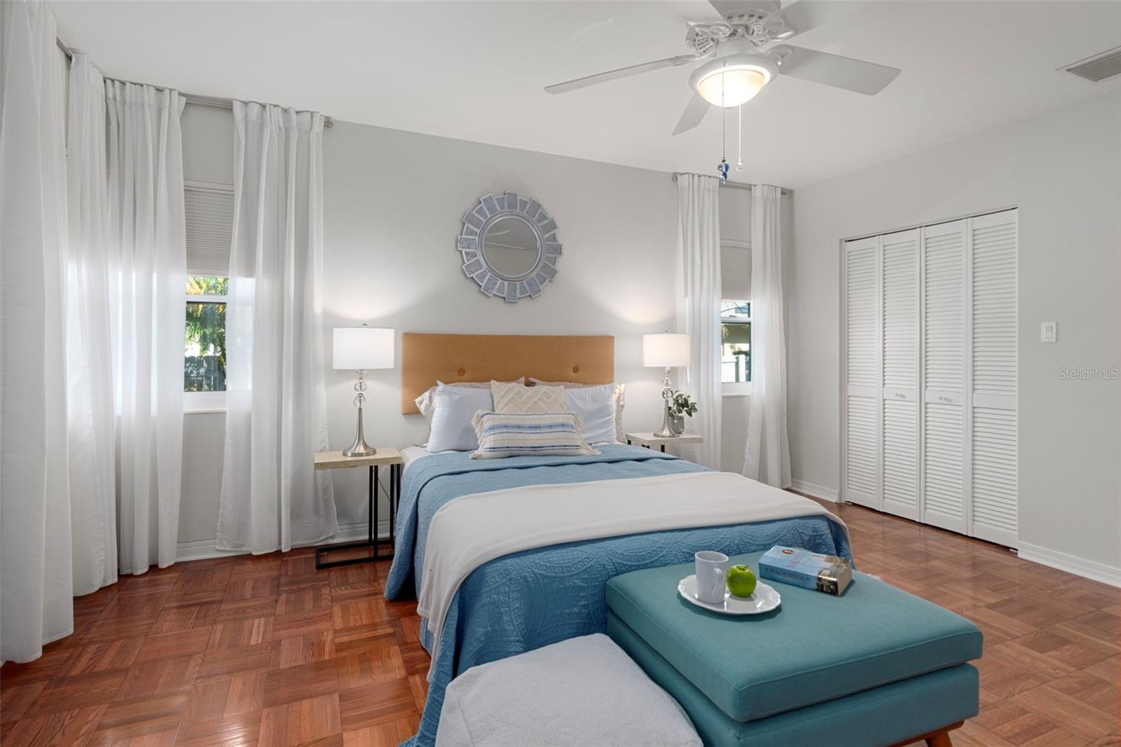 This spacious second bedroom could easily accommodate two beds, perfect for siblings or guests.