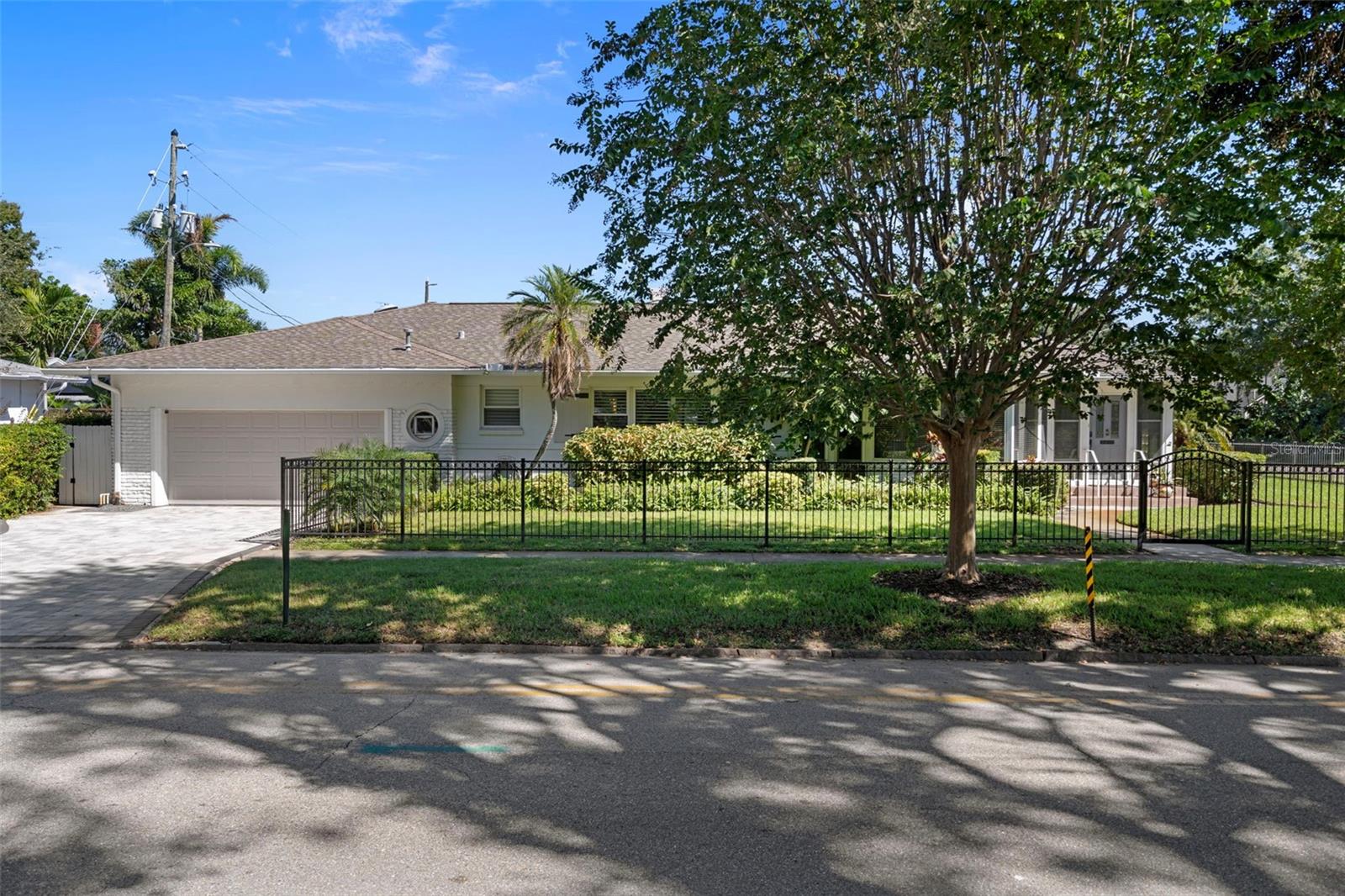 Mature landscaping surrounds the home.