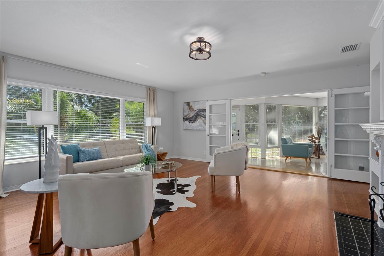 Beautiful french doors lead from the sun room to the living room.