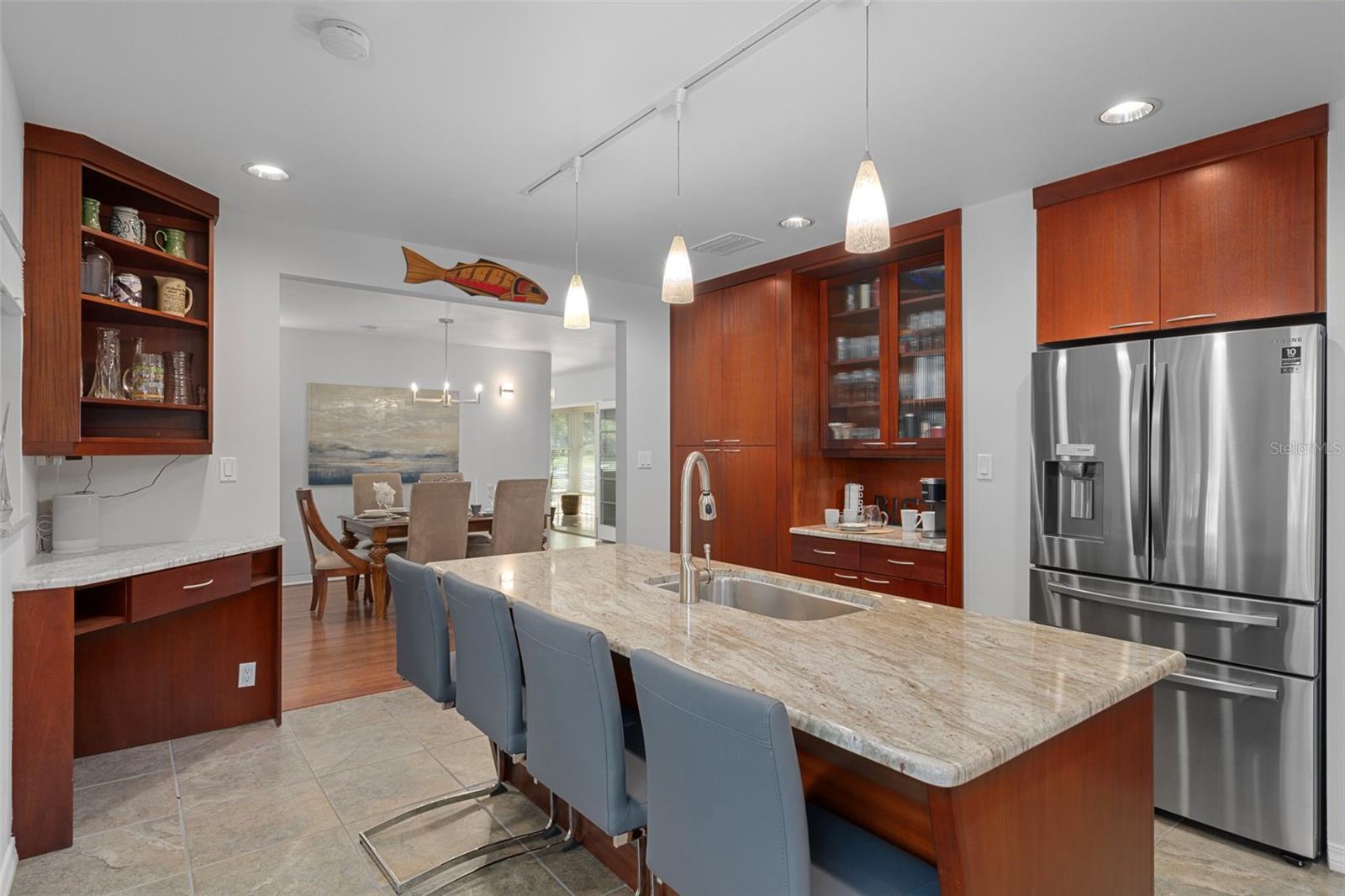 The generous island with stone countertop seats 4.