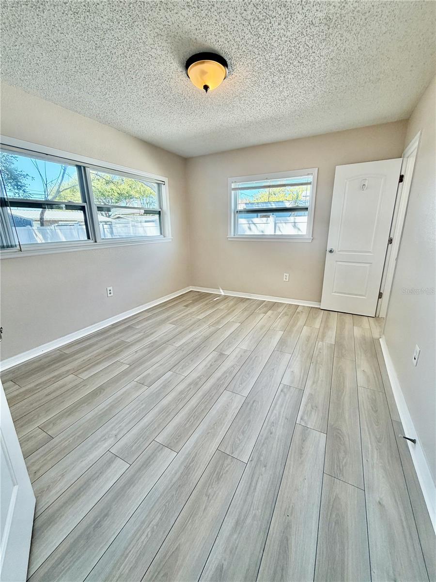 Primary Bedroom With En Suite Bathroom and Walk in Closet