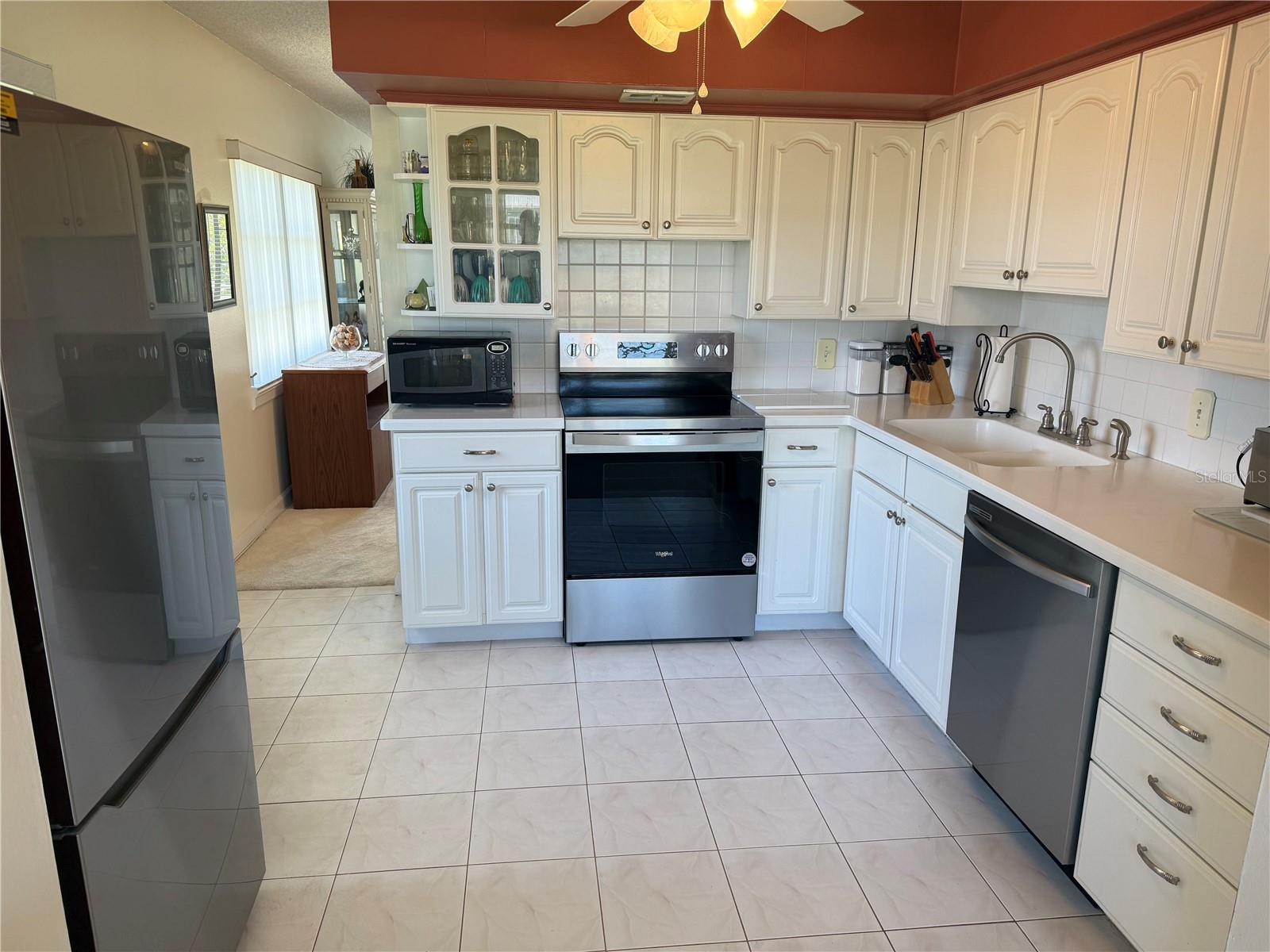 Updated kitchen with shaker cabinets, tiled backsplash and ALL NEW APPLIANCES