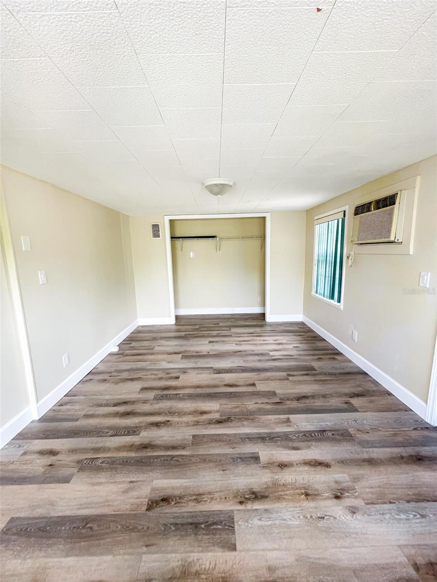 Bedroom 3 is spacious and opens up off the kitchen and has access to the screened patio.