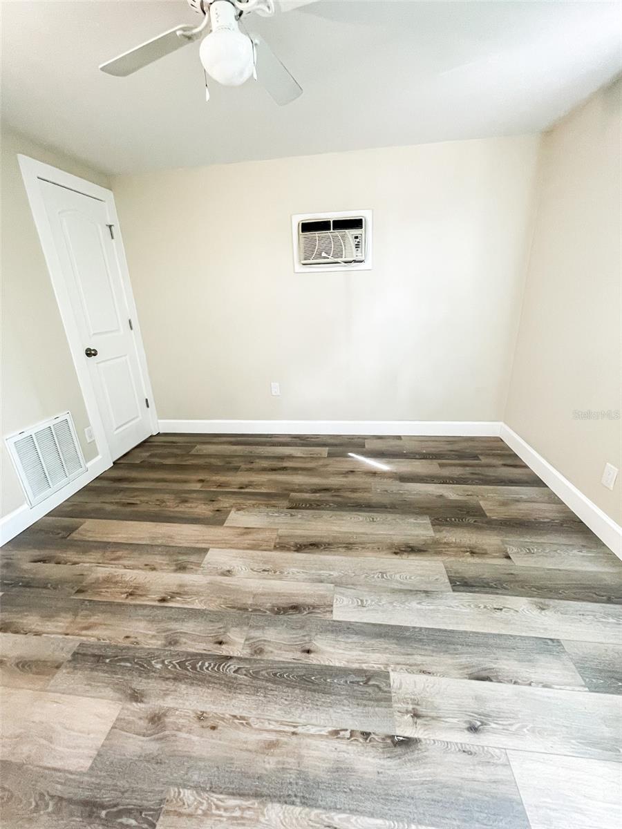 Bedroom 1 features  walk in closet