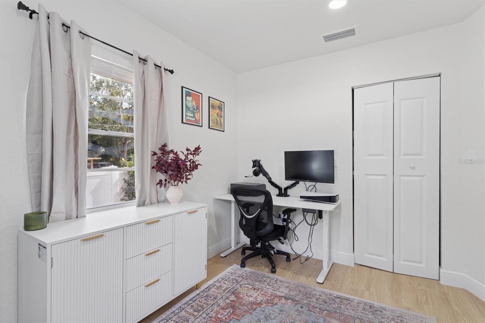 Third bedroom staged as office