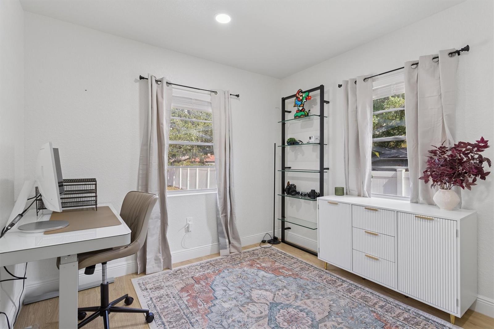 Third bedroom staged as office
