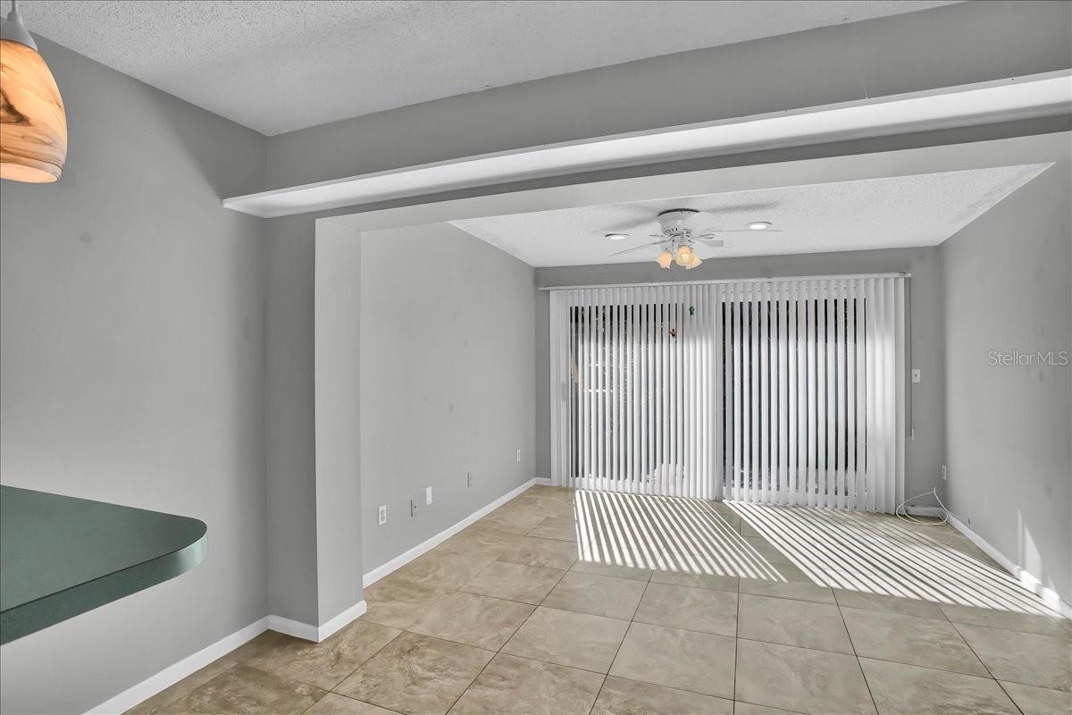 Eat in kitchen and dining area with sliders that lead to back patio