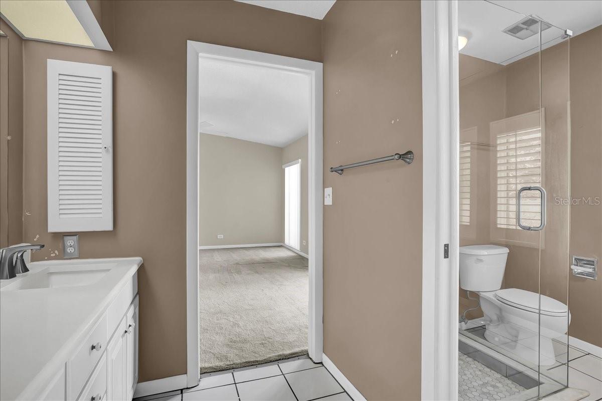 Bathroom has 1 walk in shower and another bath/tub shower