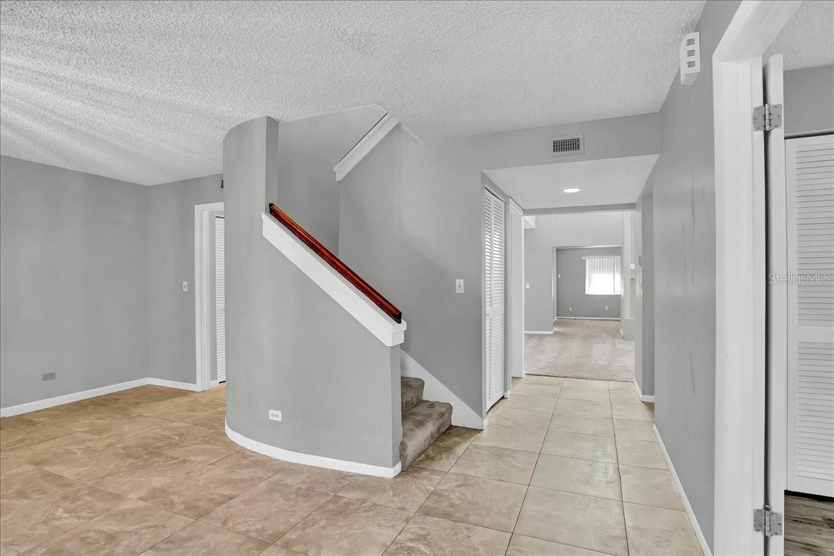 Stairwell to 2nd floor and Primary Bedroom with Ensuite Bath and 2nd bedroom with 2nd bath upstairs