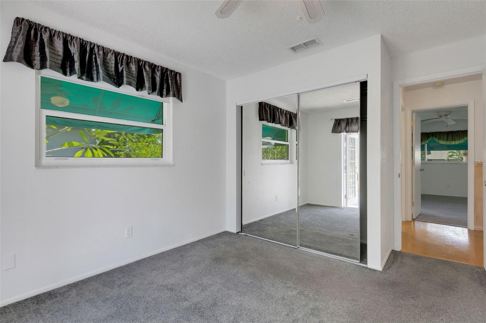 Mirrored doors reflect the pool