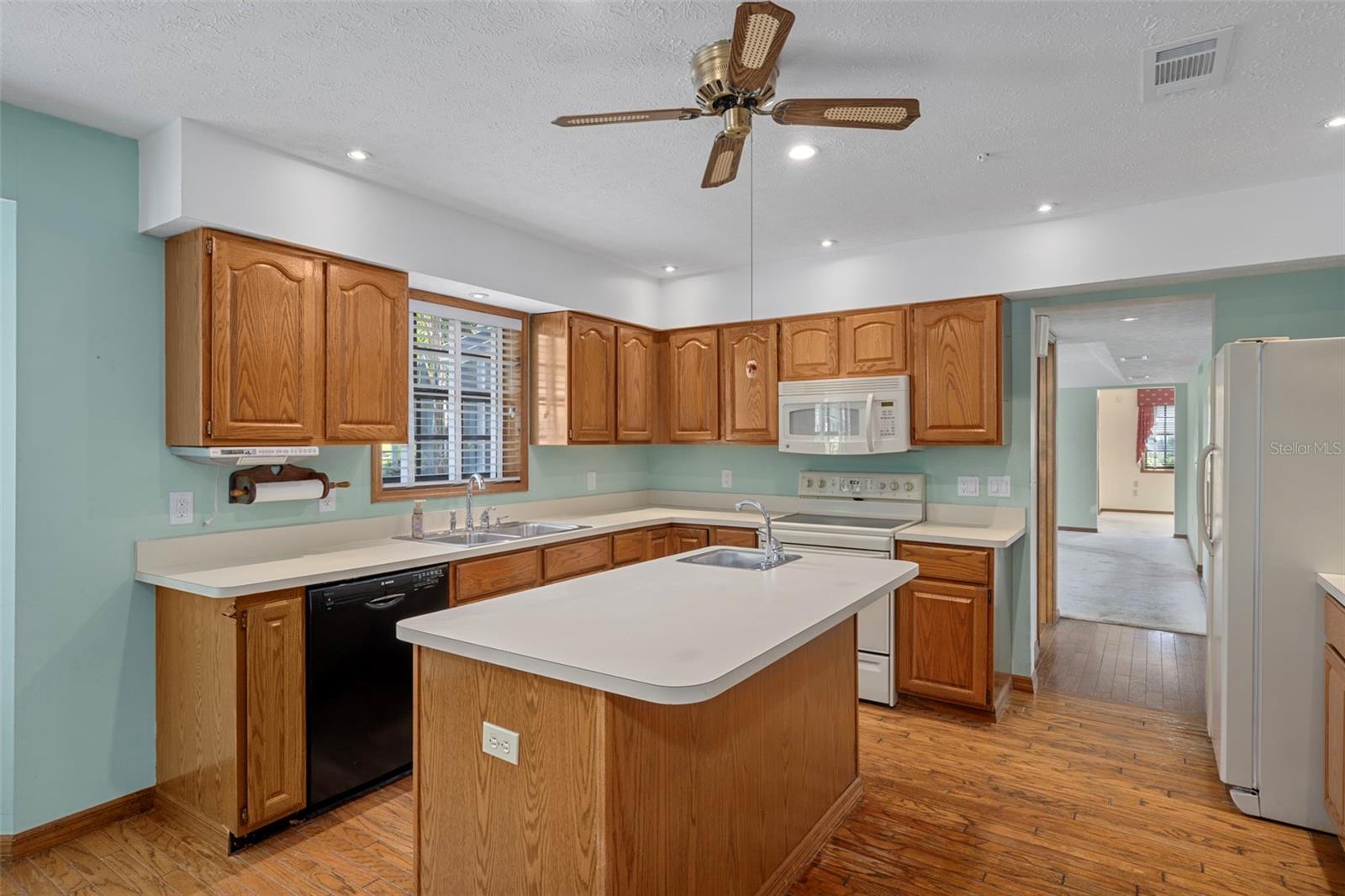 Kitchen with Island and Hardwood Floors