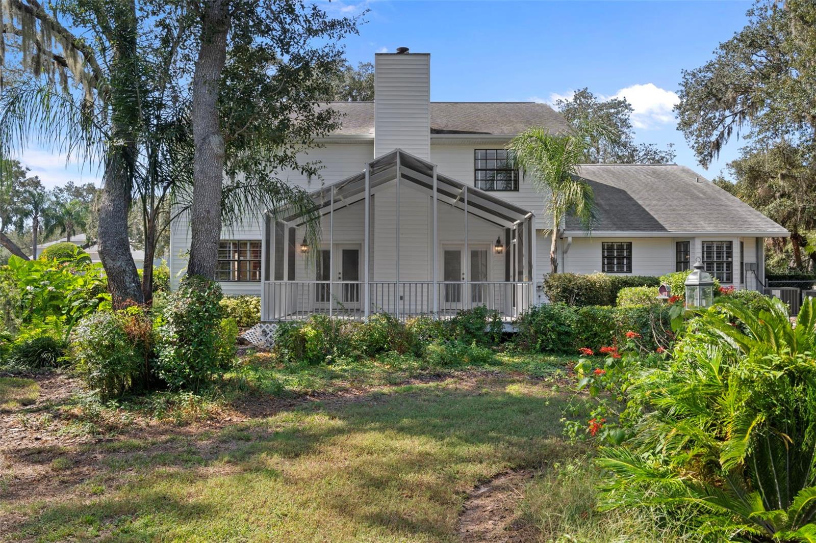 Rear of Home with Beautiul Landscaping