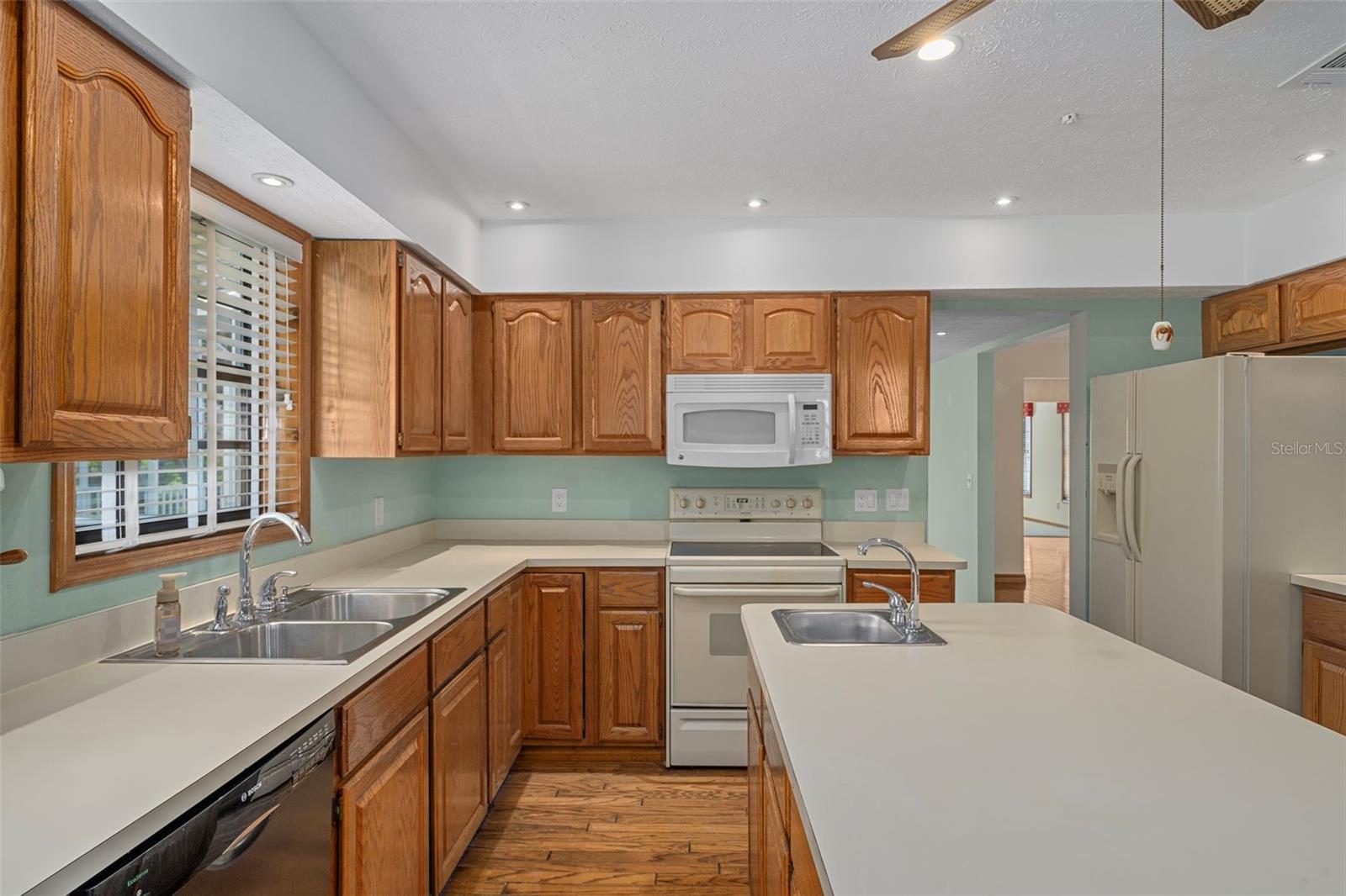 Kitchen with Ample Cabinetry/Counter Space and Hardwood Floors