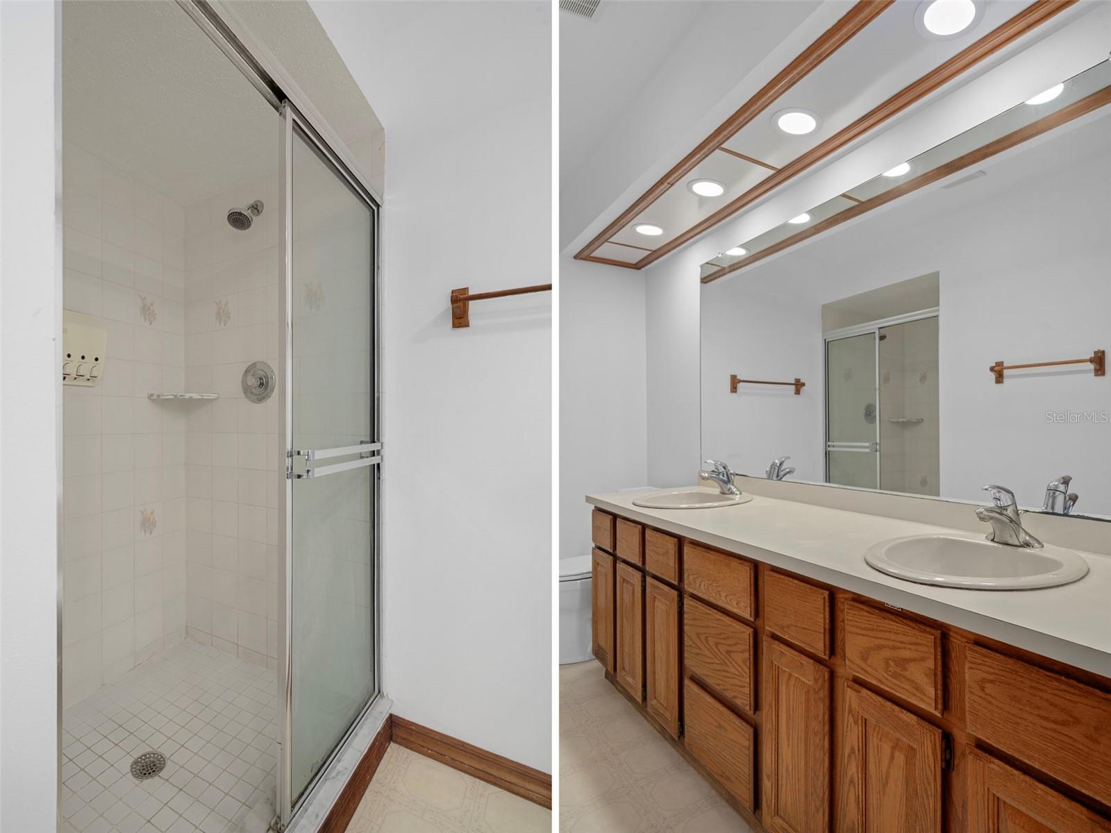 Upper Level Primary Bath with Double Sinks and Walk-in-Shower