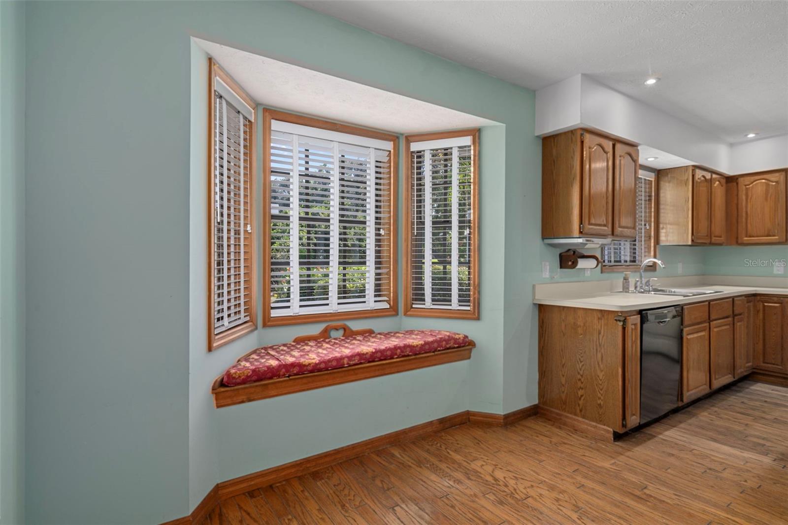 Kitchen Nook with Bay Window/Seat Overlooking Backyard and Hardwood Floors
