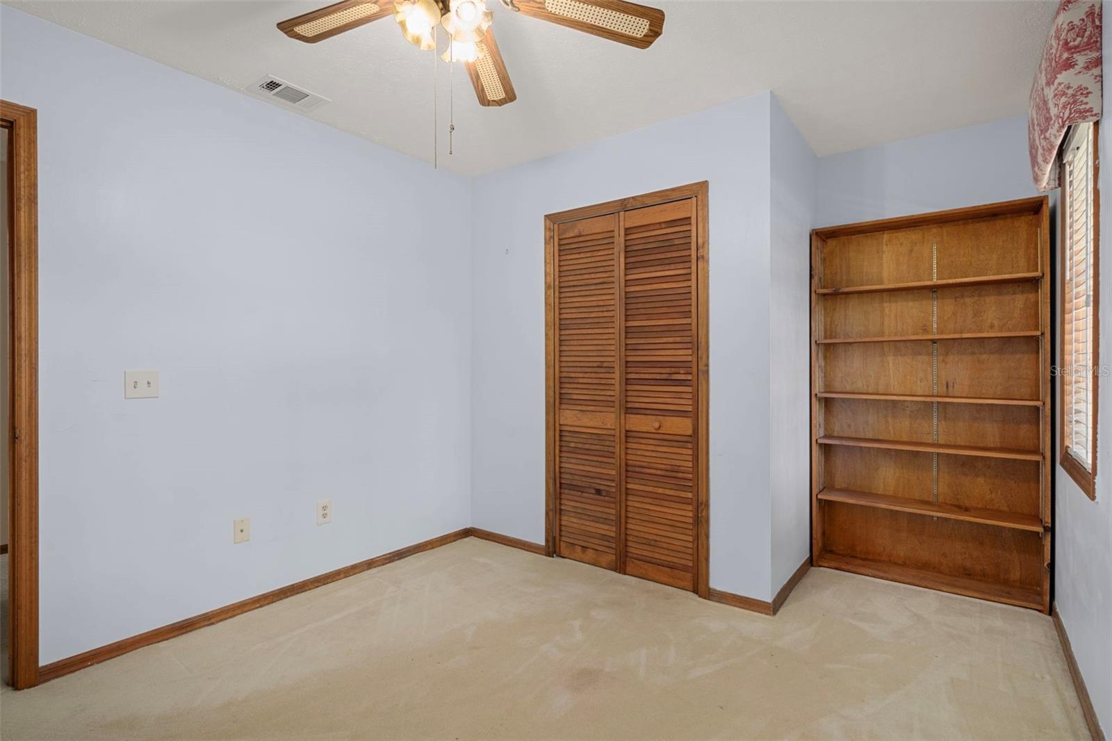 Upper Level Bedroom 2 with Walk-in-Closet and Built-in Shelves