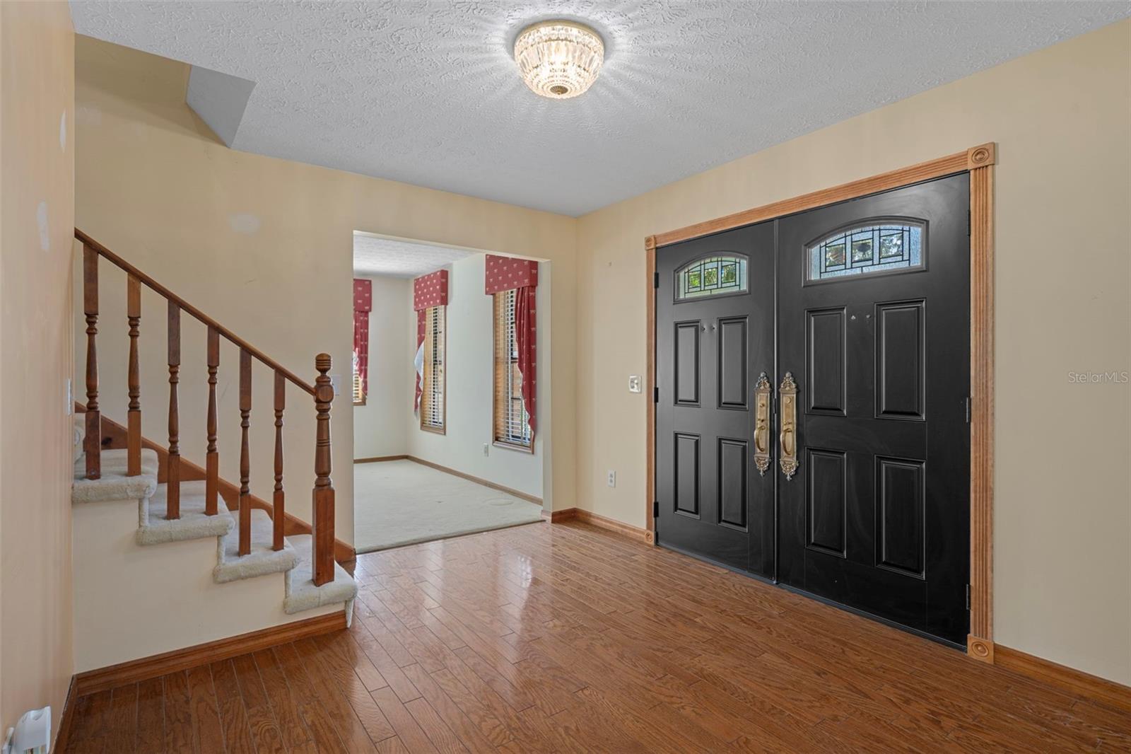 Inside Foyer with Hardwood Floors