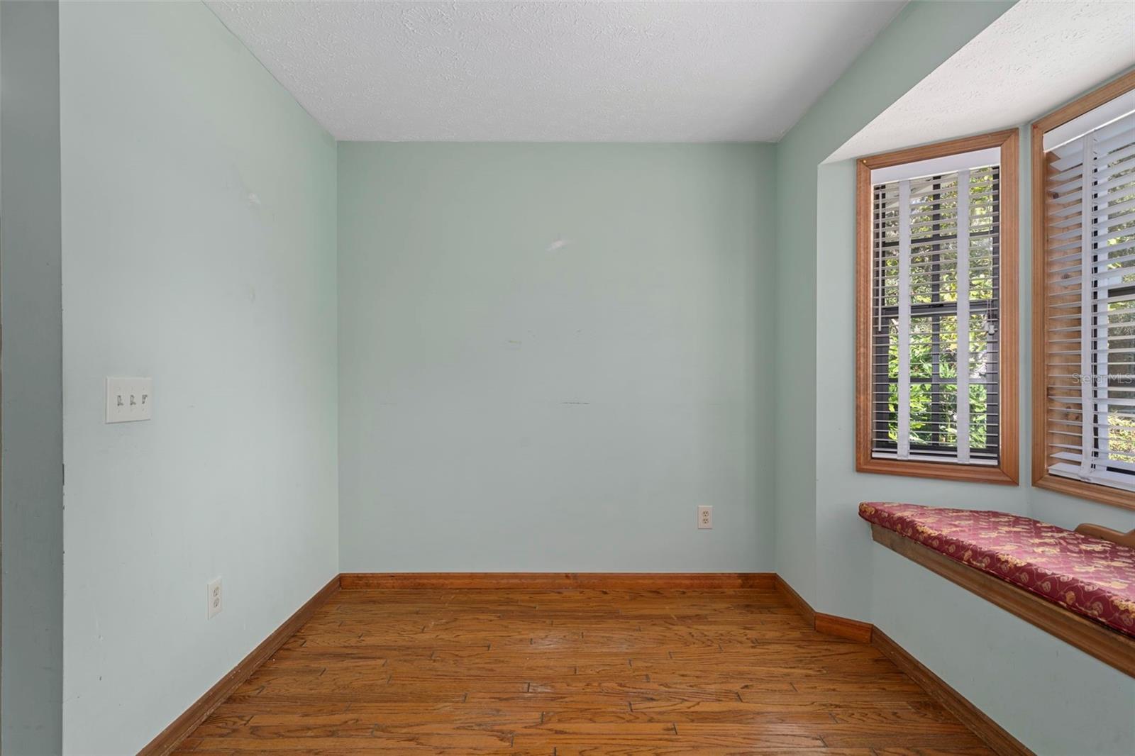 Kitchen Nook with Bay Window/Seat Overlooking Backyard and Hardwood Floors
