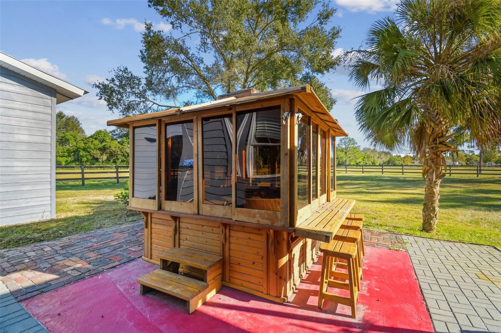 Hot tub next to house overlooks the large pasture