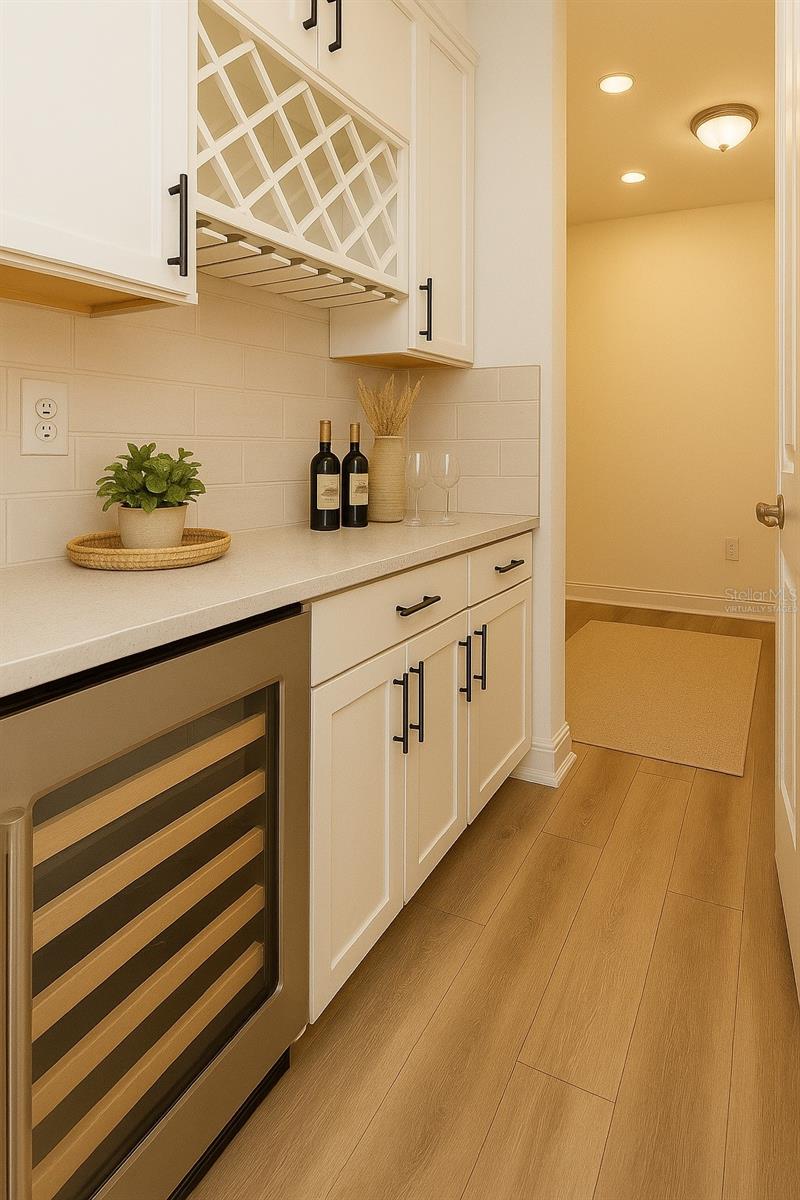 Butler pantry with wine bar. Virtually staged.
