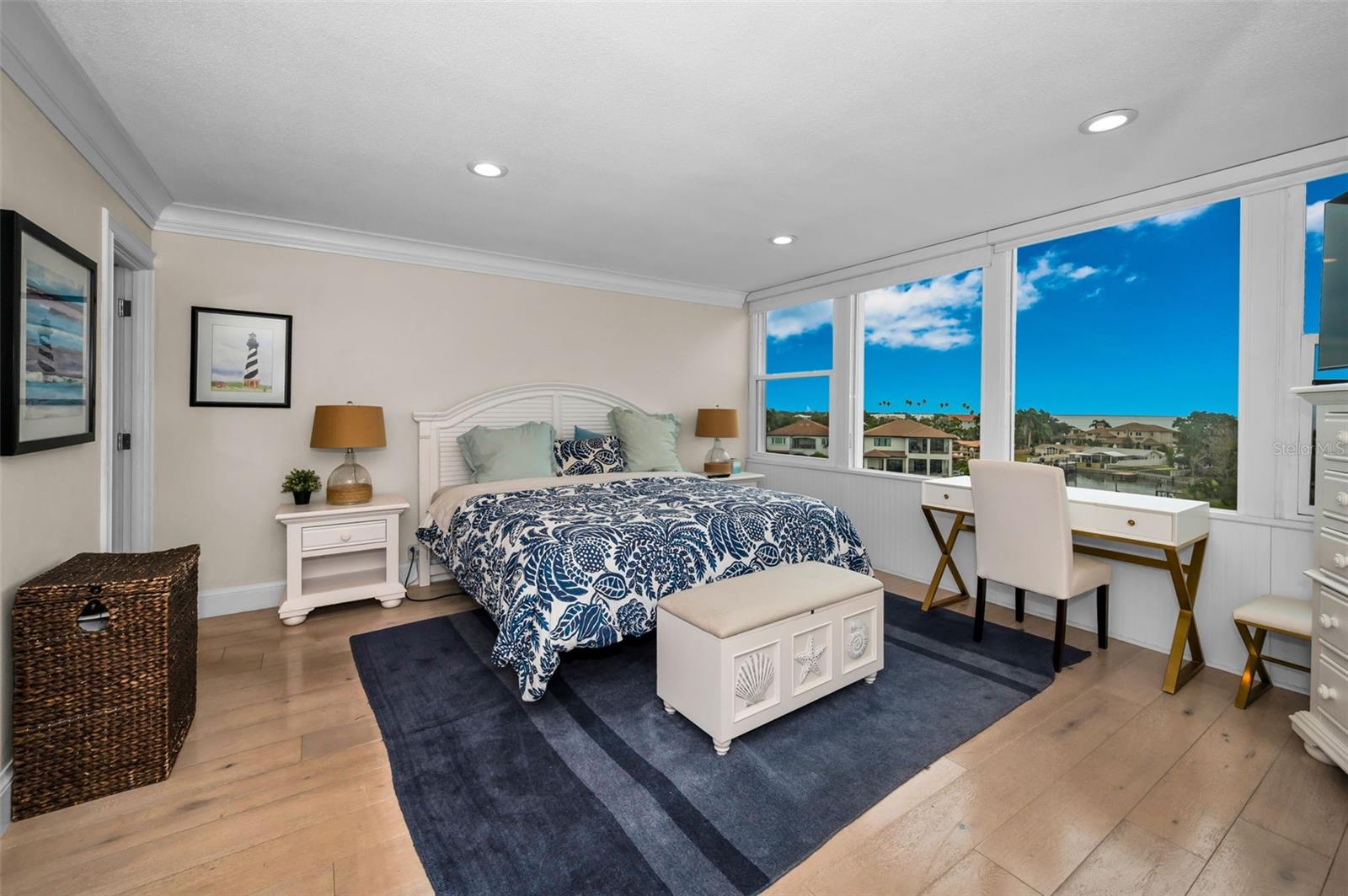 Main bedroom and its wall of beautiful windows