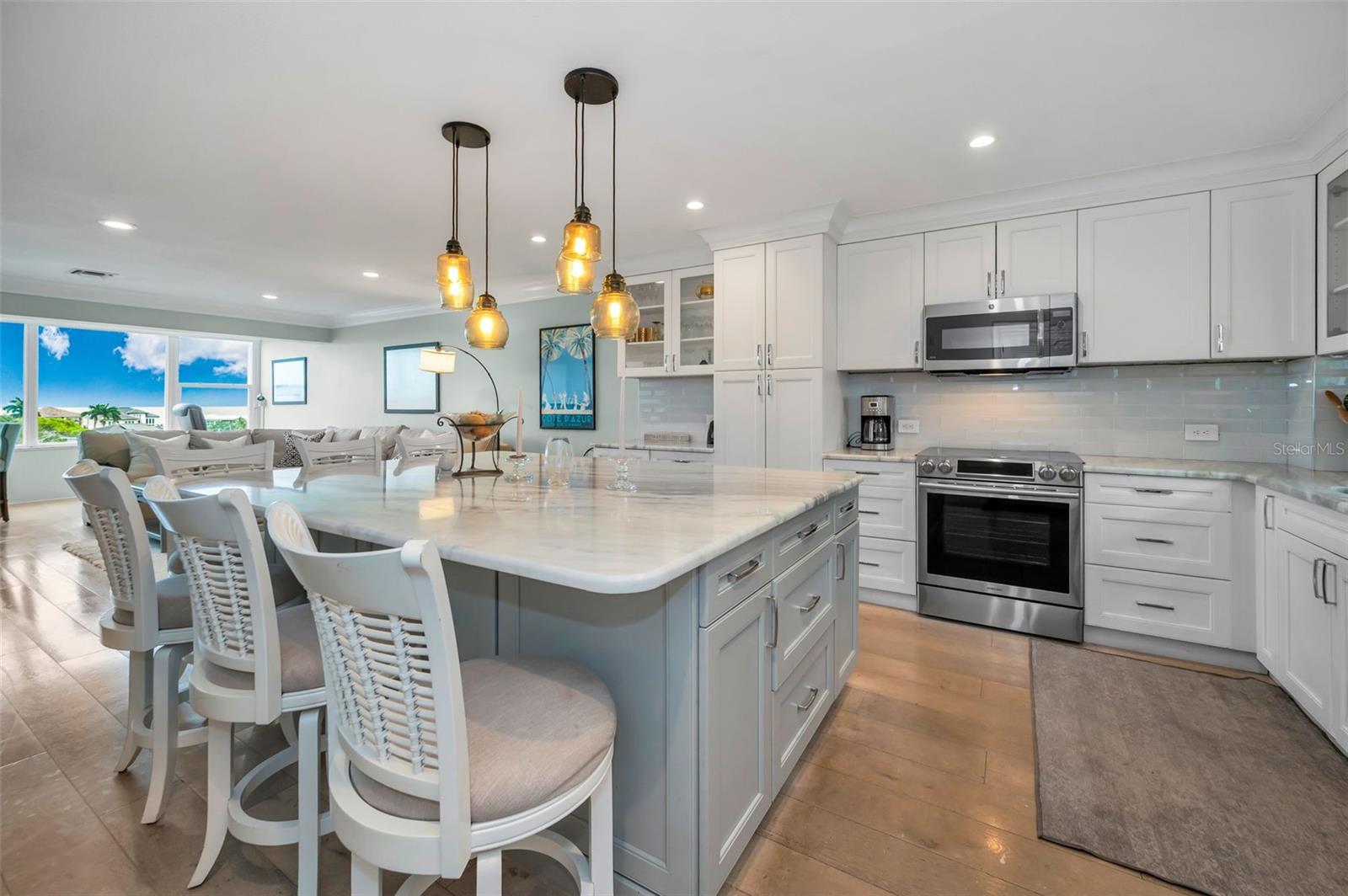 Canned lighting throughout with pretty pendand lighting